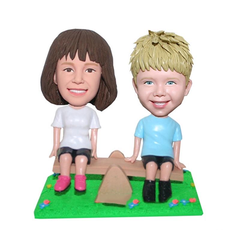 Custom Baby Bobble Heads Playing The See Saw Children's Memorial