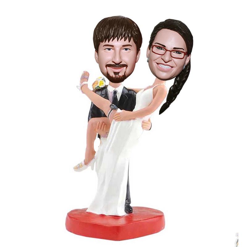 Custom Groom Holds The Bride Bobblehead Wedding Cake Toppers