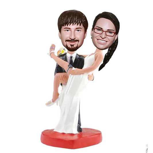 Custom Groom Holds The Bride Bobblehead Wedding Cake Toppers